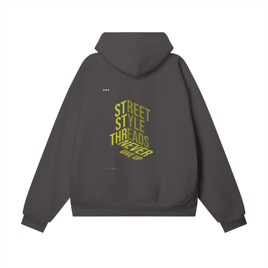 Street Style Threads hoodie featuring the 'Never Give Up' graphic on the back, oversized streetwear fit, soft brushed fleece interior, ribbed cuffs and hem, available in multiple colors.