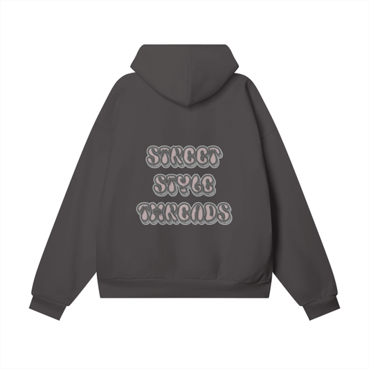 Charcoal oversized hoodie with bold pink graffiti-style ‘Street Style Threads’ text on the back.